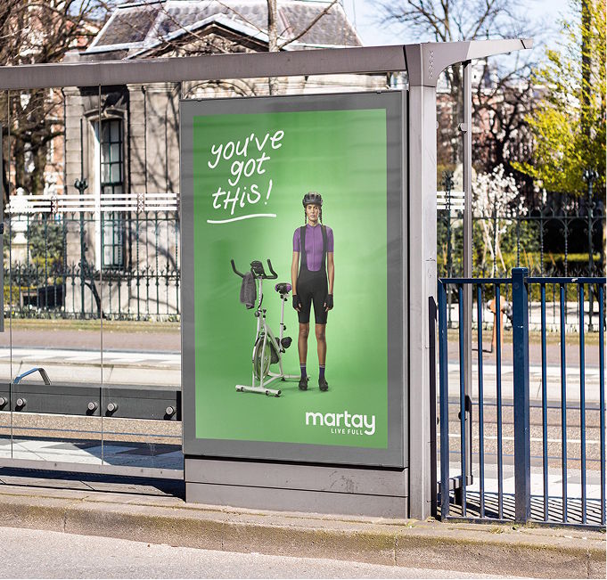 advertisement, bus stop, outdoors, person